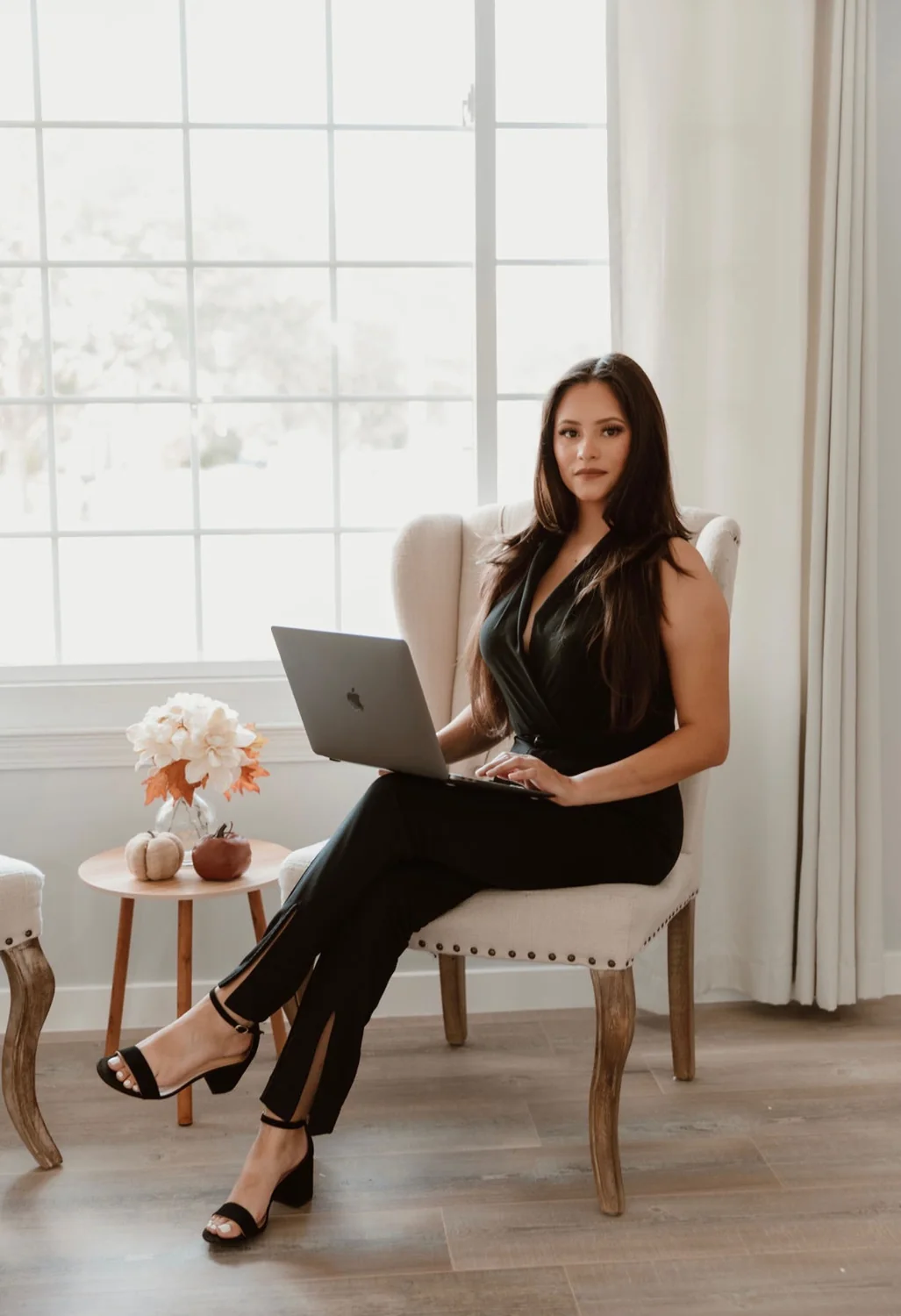 Yesenia Duran reviewing real estate strategy on a laptop